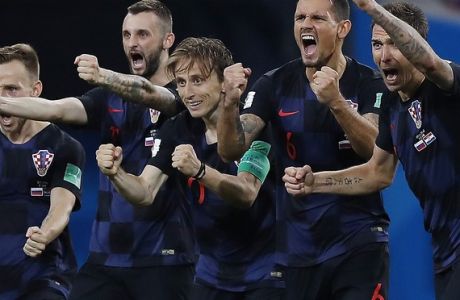 Croatia national soccer team players celebrate after a penalty is saved in a shootout during the quarterfinal match between Russia and Croatia at the 2018 soccer World Cup in the Fisht Stadium, in Sochi, Russia, Saturday, July 7, 2018. Croatia won the match 4-3 on penalties after the game ended 2-2 after extra time. (AP Photo/Manu Fernandez)