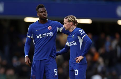 Chelsea's Benoit Badiashile, left and Chelsea's Mykhailo Mudryk reacts after the end of the English Premier League soccer match between Chelsea and Wolverhampton Wanderers at Stamford Bridge stadium in London, Sunday, Feb. 4, 2024. Wolves won the game 4-2. (AP Photo/Ian Walton)