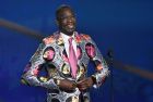 Dikembe Mutombo puts on his Sager Strong award sport coat at the NBA Awards on Monday, June 25, 2018, at the Barker Hangar in Santa Monica, Calif. (Photo by Chris Pizzello/Invision/AP)