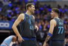 Dallas Mavericks forward Dirk Nowitzki (41), of Germany, laughs with teammate Luka Doncic (77), of Serbia, during the first half of an NBA basketball game against the Sacramento Kings in Dallas, Sunday, Dec. 16, 2018. (AP Photo/LM Otero)
