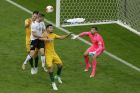 Australia goalkeeper Mathew Ryan, right, looks on as Germany's Timo Werner, second from left, goes for a header during the Confederations Cup, Group B soccer match between Australia and Germany, at the Fisht Stadium in Sochi, Russia, Monday, June 19, 2017. (AP Photo/Sergei Grits)