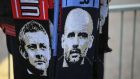 A man sells scarves with pictures of Manchester United manager Ole Gunnar Solskjaer, left, and Manchester City coach Pep Guardiola outside the stadium before before the English Premier League soccer match between Manchester United and Manchester City at Old Trafford Stadium in Manchester, England, Wednesday April 24, 2019. (AP Photo/Jon Super)