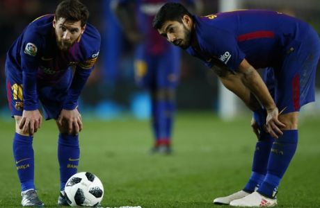 FC Barcelona's Lionel Messi, left, and Luis suarez during the Spanish Copa del Rey, semifinal, first leg, soccer match between FC Barcelona and Valencia at the Camp Nou stadium in Barcelona, Spain, Thursday, Feb. 1, 2018. (AP Photo/Manu Fernandez)