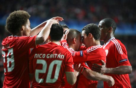 Benfica's Uruguayan defender Maxi Pereira celebrates with team mates after scoring a goal against FC Zenit Satin-Petersbourg during a Champions League round of 16 football match at the Luz Stadium in Lisbon on March 6, 2012. AFP PHOTO/ PATRICIA DE MELO MOREIRA (Photo credit should read PATRICIA DE MELO MOREIRA/AFP/Getty Images)