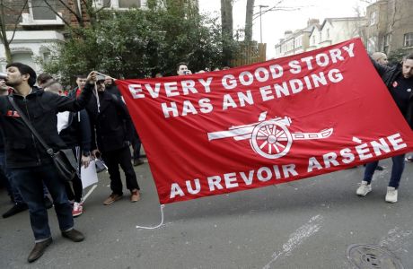 Arsenal fans march calling for the resignation of French manager Arsene Wenger ahead of their English FA Cup quarterfinal soccer match against Lincoln City at the Emirates stadium in London, Saturday, March 11, 2017. (AP Photo/Matt Dunham)