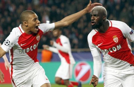 Monaco's Tiemoue Bakayoko, right, celebrates his side side's 3rd goal with Kylian Mbappe during a Champions League round of 16 second leg soccer match between Monaco and Manchester City at the Louis II stadium in Monaco, Wednesday March 15, 2017. (AP Photo/Claude Paris)