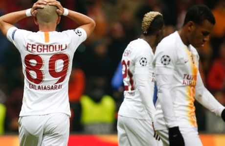Galatasaray midfielder Sofiane Feghouli, left, reacts after missing a shot against Porto during the Champions League Group D soccer match between Galatasaray and Porto in Istanbul, Tuesday, Dec. 11, 2018. (AP Photo/Lefteris Pitarakis)