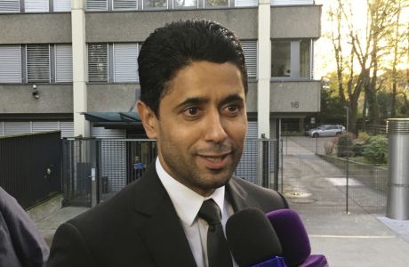 FILE - In this Wednesday Oct. 25, 2017 file photo, Paris Saint-Germain president Nasser Al-Khelaifi speaks to the media after a meeting today with Swiss prosecutors in Bern, Switzerland. Al-Khelaifi has been questioned again by Swiss federal prosecutors in a two-year investigation into allegations he bribed a FIFA official. The office of Switzerlands attorney general said on Monday, Dec. 2, 2019 al-Khelaifi, former FIFA secretary general Jerome Valcke and an unidentified businessman presented themselves for questioning in the Swiss capital. (AP Photo/Graham Dunbar, file)