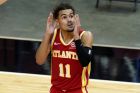 Atlanta Hawks guard Trae Young (11) reaxcrts after being called for a foul during the second half of an NBA basketball game against the Miami Heat, Sunday, Feb. 28, 2021, in Miami. (AP Photo/Lynne Sladky)