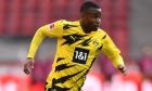 Dortmund's Youssoufa Moukoko in action during the German Bundesliga soccer match between Cologne and Dortmund at the RheinEnergieStadion stadium in Cologne, Germany, Saturday, March 20, 2021. (Marius Becker/Pool via AP)