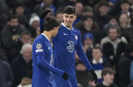 Chelsea's Kai Havertz, right, celebrates with teammate Joao Felix after scoring his sides second goal during the Champions League round of 16 second leg soccer match between Chelsea FC and Borussia Dortmund at Stamford Bridge, London, Tuesday March 7, 2023. (AP Photo/Alastair Grant)