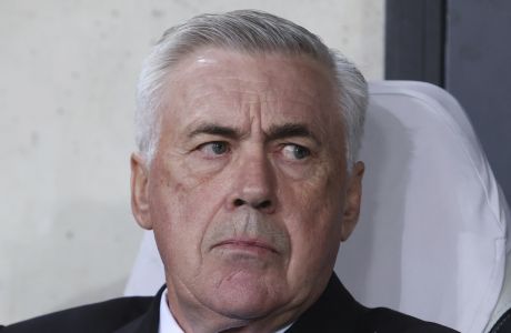 Real Madrid's head coach Carlo Ancelotti waits for the start of the Champions League group F soccer match between Shakhtar Donetsk and Real Madrid at Polish Army Stadium stadium in Warsaw, Poland, Tuesday, Oct. 11, 2022. (AP Photo/Michal Dyjuk)