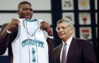 Larry Johnson of UNLV poses with NBA commissioner Dave Stern and his new team jersey after he was selected first by the Charlotte Hornets in the NBA draft at New York's Madison Square Garden, June 26, 1991. (AP Photo/Ron Frehm)