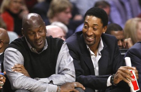 Chicago Bulls' greats Michael Jordan, left, and Scottie Pippen sit court side during the first half of an NBA basketball game between the Chicago Bulls and the Charlotte Bobcats Tuesday, Feb. 15, 2011, in Chicago. (AP Photo/Charles Rex Arbogast)