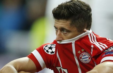 Bayern's Robert Lewandowski looks disappointed when his team failed to advance to the final during the Champions League semifinal second leg soccer match between Real Madrid and FC Bayern Munich at the Santiago Bernabeu stadium in Madrid, Spain, Tuesday, May 1, 2018. (AP Photo/Paul White)