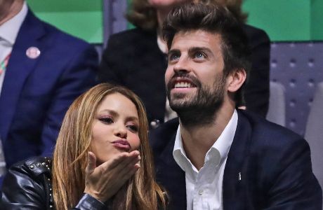 FILE - Colombian singer Shakira blows a kiss next to her husband Barcelona soccer player Gerard Pique while watching the Davis Cup final in Madrid, Spain, on Nov. 24, 2019. Colombian pop star Shakira and her partner, Spanish soccer star Gerard Piqué, are separating. In a statement released on Saturday by Shakira's PR firm, the pair said: We regret to confirm that we are separating. For the well-being of our children, who are our highest priority, we ask that you respect our privacy. (AP Photo/Manu Fernandez, File)