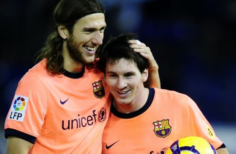 FC Barcelona's Lionel Messi of Argentina, right, reacts with his teammate Dimitro Chygrynskiy of the Ukraine after his hat-trick, during a Spanish La Liga soccer match against Tenerife,  at the Heliodoro Rodriguez Lopez stadium on the Canary Island of Santa Cruz de Tenerife, Spain, Sunday, Jan. 10, 2010. (AP Photo/Manu Fernandez)