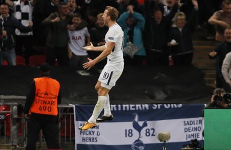 Tottenham's Harry Kane celebrates after scoring his side third goal during the Champions League group H soccer match between Tottenham and Borussia Dortmund, at the Wembley stadium in London, Wednesday, Sept. 13, 2017. (AP Photo/Kirsty Wigglesworth)
