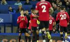 Manchester United's Cristiano Ronaldo, left, reacts after scoring his side's second goal during the Premier League soccer match between Everton and Manchester United at Goodison Park, in Liverpool, England, Sunday Oct. 9, 2022. (AP Photo/Jon Super)