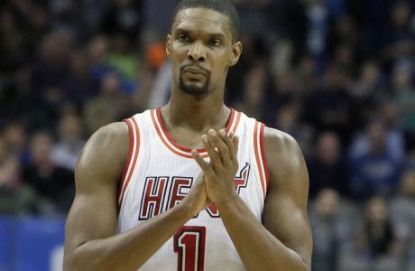 FILE - In this Feb. 3, 2016, file photo, Miami Heat forward Chris Bosh (1) reacts to a call during the second half of an NBA basketball game against the Dallas Mavericks, in Dallas. Bosh was dealing with more than one blood clot earlier this year, and said Wednesday, Sept. 21, 2016,  that he felt written off when Miami Heat team doctors advised him that the situation would likely be career-ending.
(AP Photo/LM Otero, File)