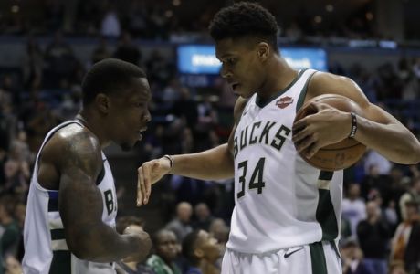 Milwaukee Bucks' Eric Bledsoe and Giannis Antetokounmpo celebrate during the second half of an NBA basketball game against the Minnesota Timberwolves Thursday, Dec. 28, 2017, in Milwaukee. The Bucks won 102-96. (AP Photo/Morry Gash)
