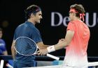 Switzerland's Roger Federer, left, is congratulated by Uzbekistan's Denis Istomin after winning their first round match at the Australian Open tennis championships in Melbourne, Australia, Monday, Jan. 14, 2019.(AP Photo/Aaron Favila)