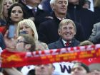 Former Liverpool player and manager Kenny Dalglish, center, smiles on the stands during the Champions League semifinal, first leg, soccer match between Liverpool and AS Roma at Anfield Stadium, Liverpool, England, Tuesday, April 24, 2018. (AP Photo/Dave Thompson)