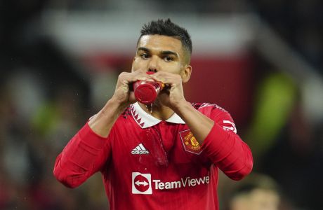 Manchester United's Casemiro drinks water during the English Premier League soccer match between Manchester United and West Ham United at Old Trafford stadium in Manchester, England, Sunday, Oct. 30, 2022. (AP Photo/Jon Super)