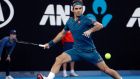 Switzerland's Roger Federer makes a forehand return to Greece's Stefanos Tsitsipas during their fourth round match at the Australian Open tennis championships in Melbourne, Australia, Sunday, Jan. 20, 2019. (AP Photo/Mark Schiefelbein)
