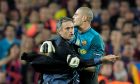 FC Barcelona's goalkeeper Victor Valdes, right, clashes with Inter Milan's coach Jose Mourinho from Portugal celebrating at the end of the Champions League semifinal second leg soccer match between FC Barcelona and Inter Milan at the Camp Nou stadium in Barcelona, Spain, Wednesday, April 28, 2010.  Inter lost the match 0-1, but went through to the final 3-2 on aggregate.  (AP Photo/David Ramos)