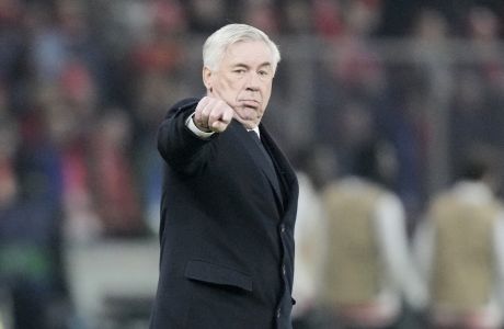 Real Madrid's head coach Carlo Ancelotti gestures during the Champions League group C soccer match between Union Berlin and Real Madrid at the Olympiastadion in Berlin, Tuesday, Dec. 12, 2023. (AP Photo/Markus Schreiber)
