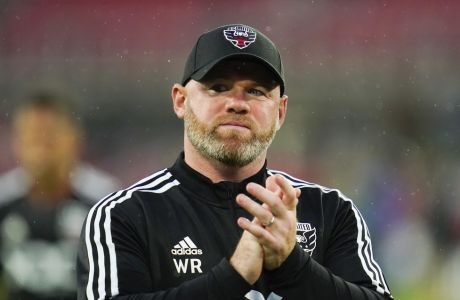 D.C. United head coach Wayne Rooney reacts after an MLS soccer match against Orlando City, Sunday, July 31, 2022, in Washington. D.C. United won 2-1. (AP Photo/Julio Cortez)
