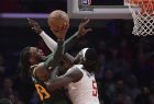 Utah Jazz forward Jae Crowder, left, shoots as Los Angeles Clippers forward Montrezl Harrell defends during the second half of an NBA basketball game Wednesday, Jan. 16, 2019, in Los Angeles. The Jazz won 129-109. (AP Photo/Mark J. Terrill)