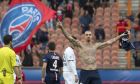 Paris St Germain's Zlatan Ibrahimovic celebrates after scoring a goal against Caen during their French Ligue 1 soccer match at Parc des Princes stadium in Paris, February 14, 2015.  REUTERS/Philippe Wojazer (FRANCE - Tags: SPORT SOCCER) - RTR4PKLA