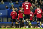 Manchester United's Cristiano Ronaldo, left, reacts after scoring his side's second goal during the Premier League soccer match between Everton and Manchester United at Goodison Park, in Liverpool, England, Sunday Oct. 9, 2022. (AP Photo/Jon Super)