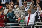 Arsenal manager Arsene Wenger, right, and Arsenal's goalkeeper Petr Cech hold the trophy to celebrate after winning the English Community Shield soccer match between Arsenal and Chelsea at Wembley Stadium in London, Sunday, Aug. 6, 2017. (AP Photo/Frank Augstein)