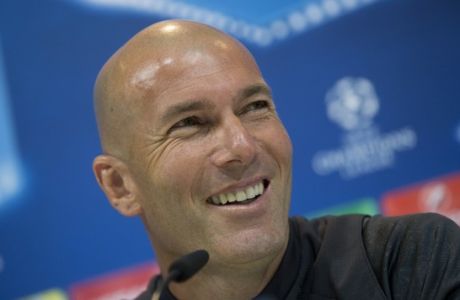 Real Madrid's head coach Zinedine Zidane smiles during a training session in Madrid, Tuesday May 9, 2017. Real Madrid will play against Atletico Madrid on Wednesday in a Champions League semifinal, 2nd leg soccer match. (AP Photo/Paul White)