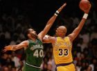 Kareem Abdul Jabbar of the Los Angeles Lakers goes up for a skyhook, as James Donaldson of the Dallas Mavericks tries to block him, during NBA playoffs at The Forum, in Inglewood, Calif., on May 23, 1988. The Lakers won 113-98.  (AP Photo/Reed Saxon)