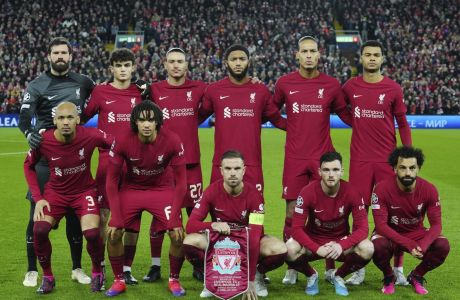 Liverpool team players pose prior to the start of the Champions League, round of 16, first leg soccer match between Liverpool and Real Madrid at the Anfield stadium in Liverpool, England, Tuesday, Feb. 21, 2023. (AP Photo/Jon Super)