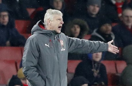 Arsenal manager Arsene Wenger gestures during the English Premier League soccer match between Arsenal and Manchester City at the Emirates stadium in London, Thursday, March 1, 2018.(AP Photo/Frank Augstein)