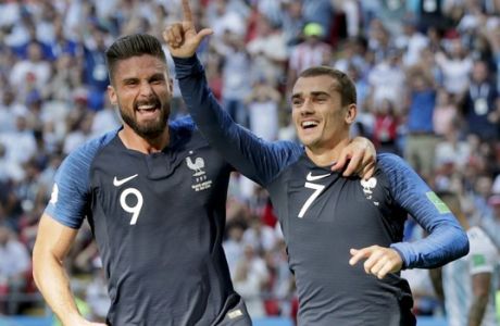 France's Antoine Griezmann, right, celebrates after scoring the penalty opening goal with France's Olivier Giroud, left, during the round of 16 match between France and Argentina, at the 2018 soccer World Cup at the Kazan Arena in Kazan, Russia, Thursday, June 28, 2018. (AP Photo/Ricardo Mazalan)