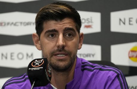 Real Madrid's goalkeeper Thibaut Courtois, speaks during a press conference, at Al Nassr stadium, in Riyadh, Saudi Arabia Tuesday, Jan. 10, 2023. Real Madrid will play the Spanish Super Cup semifinal soccer match against Valencia on Wednesday Jan. 11, 2023 at King Fahd stadium in Riyadh.(AP Photo/Hussein Malla)