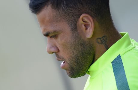 FC Barcelona's Daniel Alves from Brazil attends a training session at the Sports Center FC Barcelona Joan Gamper in San Joan Despi, Spain, Tuesday, March 17, 2015. FC Barcelona will play against Manchester City in a Champions League on Wednesday March 18. (AP Photo/Manu Fernandez)