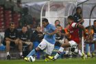 Manchester City's Carlos Tevez, left, controls the ball during a friendly match against Arsenal at China's National Stadium in Beijing, Friday July 27, 2012.  Manchester City won the match 2-0. (AP Photo/Alexander F. Yuan)
