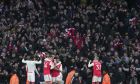 Arsenal's players celebrate at the end of the English Premier League soccer match between Arsenal and Bournemouth at the Emirates stadium in London, England, Saturday, March 4, 2023. (AP Photo/Kin Cheung)