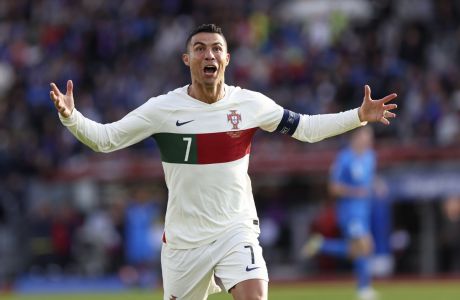 Portugal's Cristiano Ronaldo celebrates after scoring his side's first goal during the Euro 2024 group J qualifying soccer match between Iceland and Portugal in Reykjavík, Iceland, Tuesday, June 20, 2023. (AP Photo/Árni Torfason)