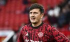 Manchester United's Harry Maguire looks on during warm up before the English Premier League soccer match between Manchester United and Wolverhampton at the Old Trafford stadium in Manchester, England, Monday, Aug. 14, 2023. (AP Photo/Rui Vieira)