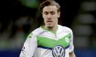 FILE - Wolfsburg's then player Max Kruse during the Champions League round of sixteen 2nd leg soccer match between VfL Wolfsburg and KAA Gent in Wolfsburg, Germany, Tuesday, March 8, 2016. After signing Max Kruse again German Bundeliga team Wolfsburg is banking on a victory against last-place Greuther Fürth on Sunday after failing to win any of its last nine Bundesliga games. Wolfsburg clinched fourth place and qualification for Europes premiere competition last season, now it's just two points above the relegation zone after 20 rounds of the league.(AP Photo/Michael Sohn,file)