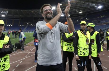 Liverpool coach Jurgen Klopp celebrates with the supporters at the end of the Champions League semifinal second leg soccer match between Roma and Liverpool at the Olympic Stadium in Rome, Wednesday, May 2, 2018. (AP Photo/Alessandra Tarantino)