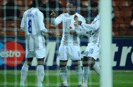 CSKA Moscow's Ivorian forward Seydou Doumbia (L) is congratulated by teammates during the Champions League match Inter Milan vs CSKA Moscow on December 7, 2011 in San Siro Stadium in Milan. AFP PHOTO / OLIVIER MORIN (Photo credit should read OLIVIER MORIN/AFP/Getty Images)